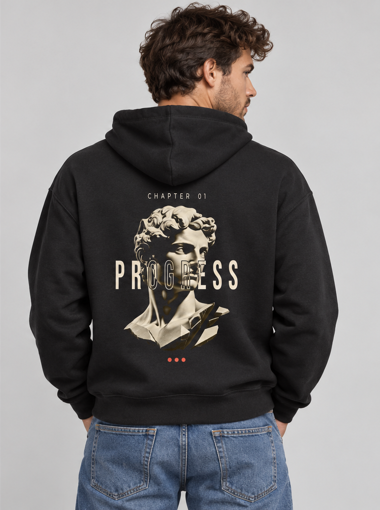 Male model wearing the black Unfinished Sculpture Hoodie, back view