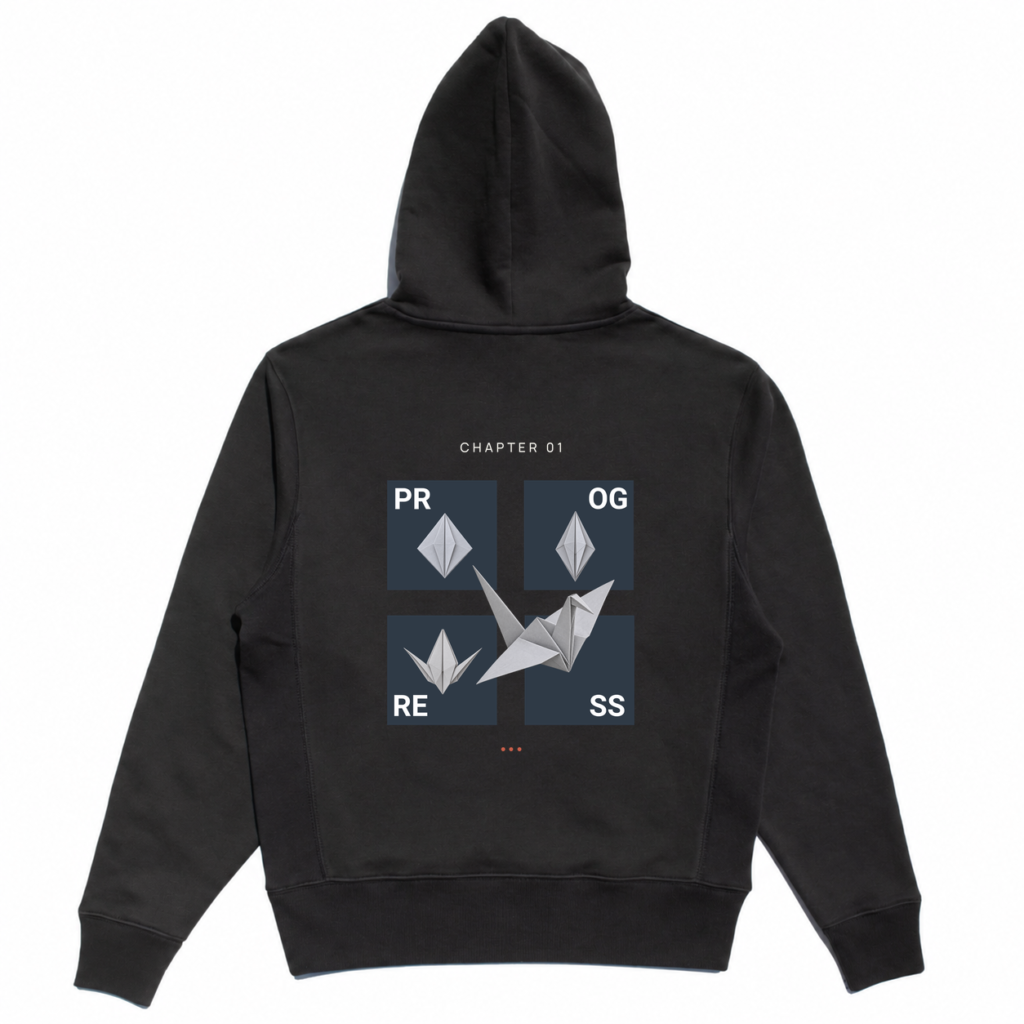 Back view of the black Transform Hoodie with four PROGRESS panels, silver origami crane stages, CHAPTER 01 text, and three coral dots.