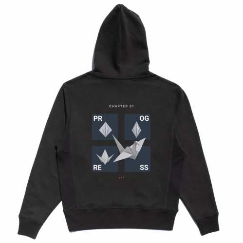 Back view of the black Transform Hoodie with four PROGRESS panels, silver origami crane stages, CHAPTER 01 text, and three coral dots.