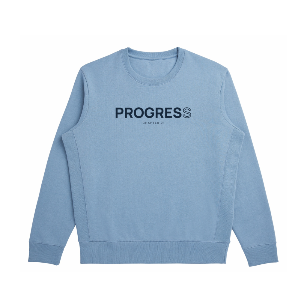 Front view of the Cloudy Blue Minimal Progress Sweatshirt with navy PROGRESS lettering, an outlined final S, and CHAPTER 01 text.